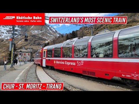 Red Bernina Express panoramic train at a station between Chur, St. Moritz and Tirano